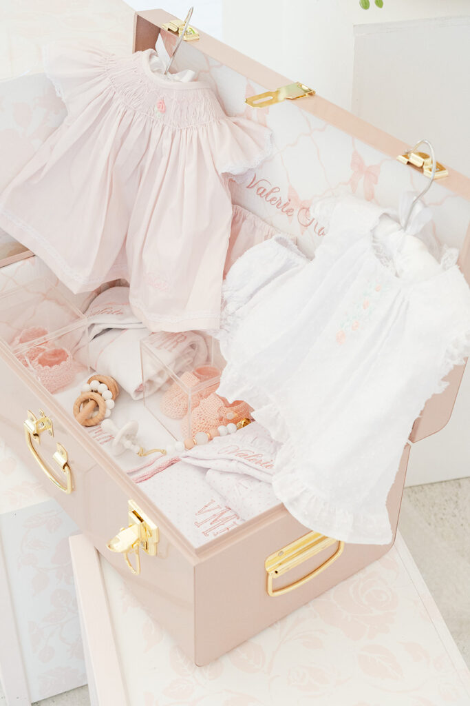Vintage-inspired floral trunk overflowing with blush roses and hydrangeas.